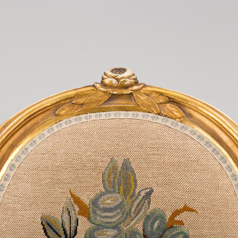 A Gustavian style arm chair, first half ot the 20th Century.