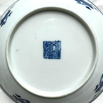 A pair of blue and white floral dishes, Qing dynasty, with Qianlong mark and of the period (1736-95).