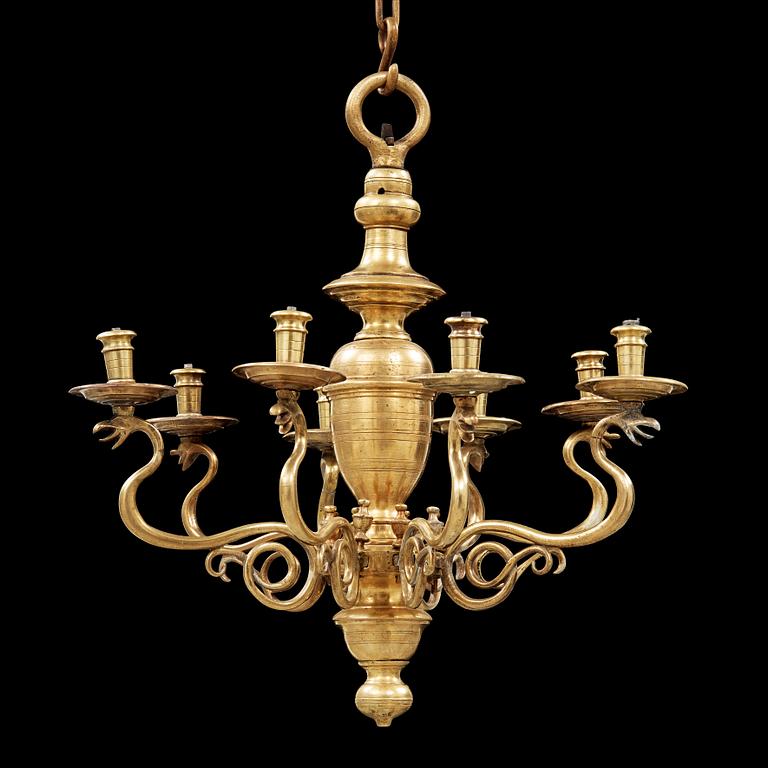A 19th century eight-light brass chandelier in the manner of Hans Rogiers van Harelbeke.