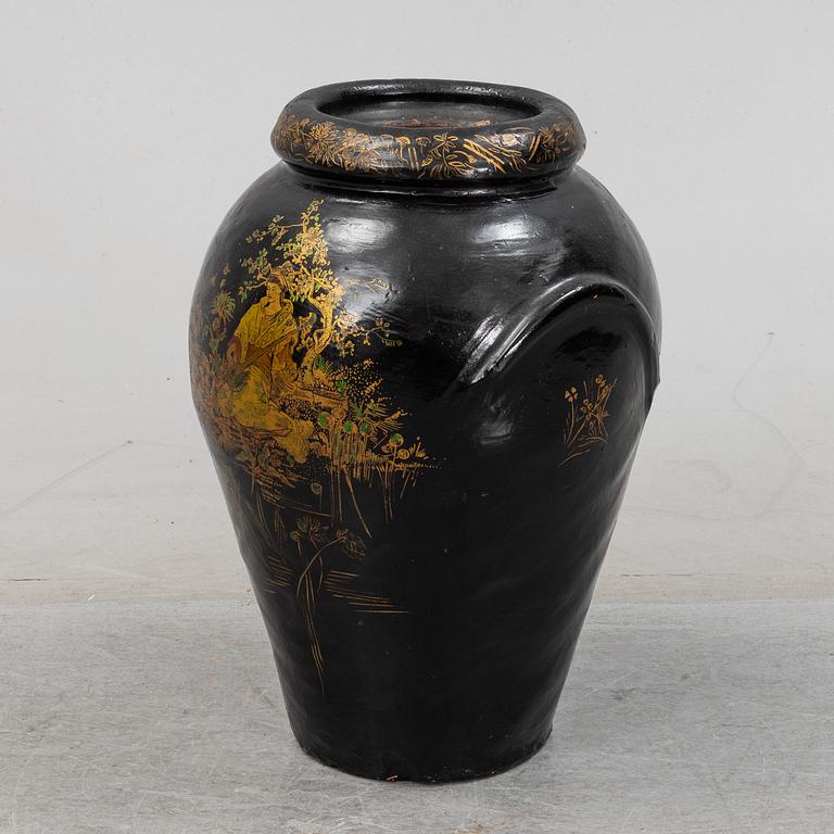 A 20th Century earhten ware urn.