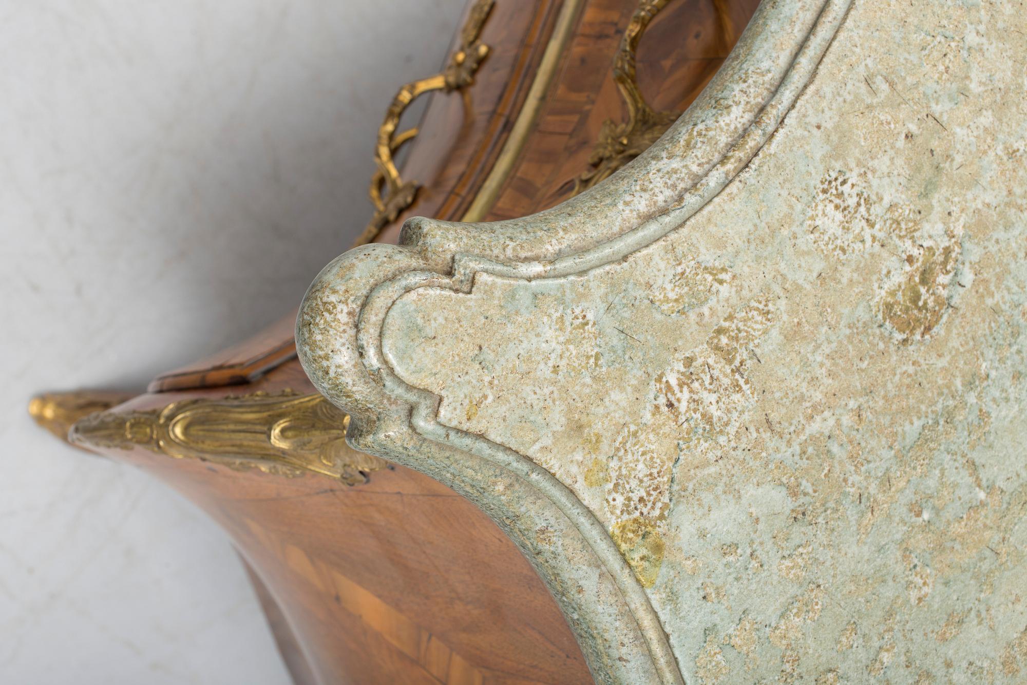 A 1700s rococo commode.