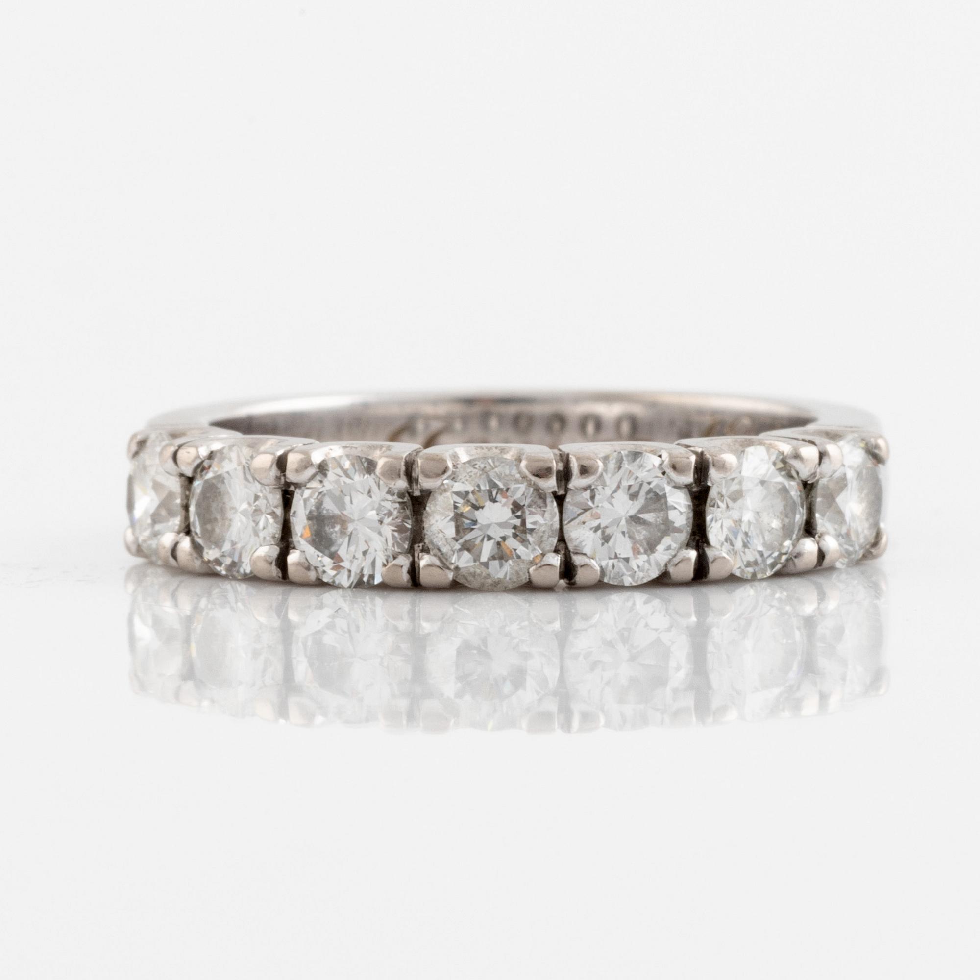 A WA Bolin 18K ring set with round brilliant-cut diamonds.