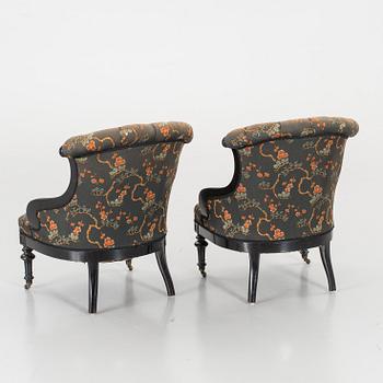 A pair of late 19th century lounge chairs.