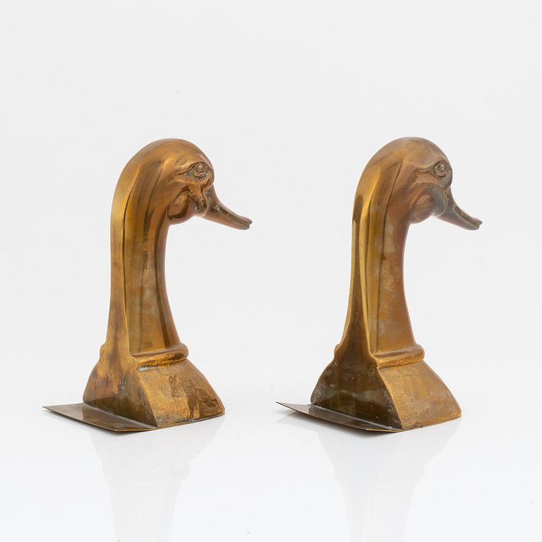 A pair of brass book stands, 20th century.