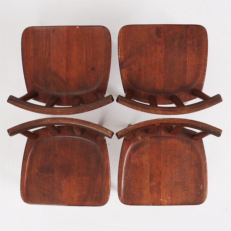 Axel Einar Hjorth, a set of four stained pine 'Utö' chairs, Nordiska Kompaniet Sweden 1930's.