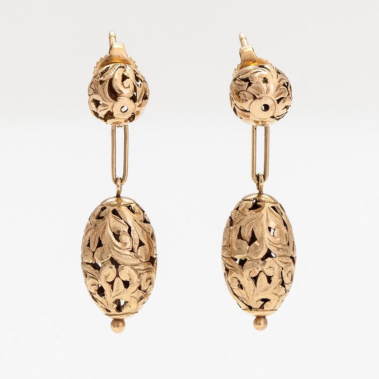 A pair of 14K gold earrings.