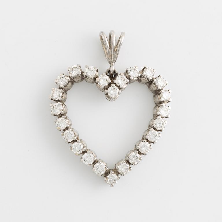 An 18K heartd pendant set wtih round brilliant-cut diamonds.
