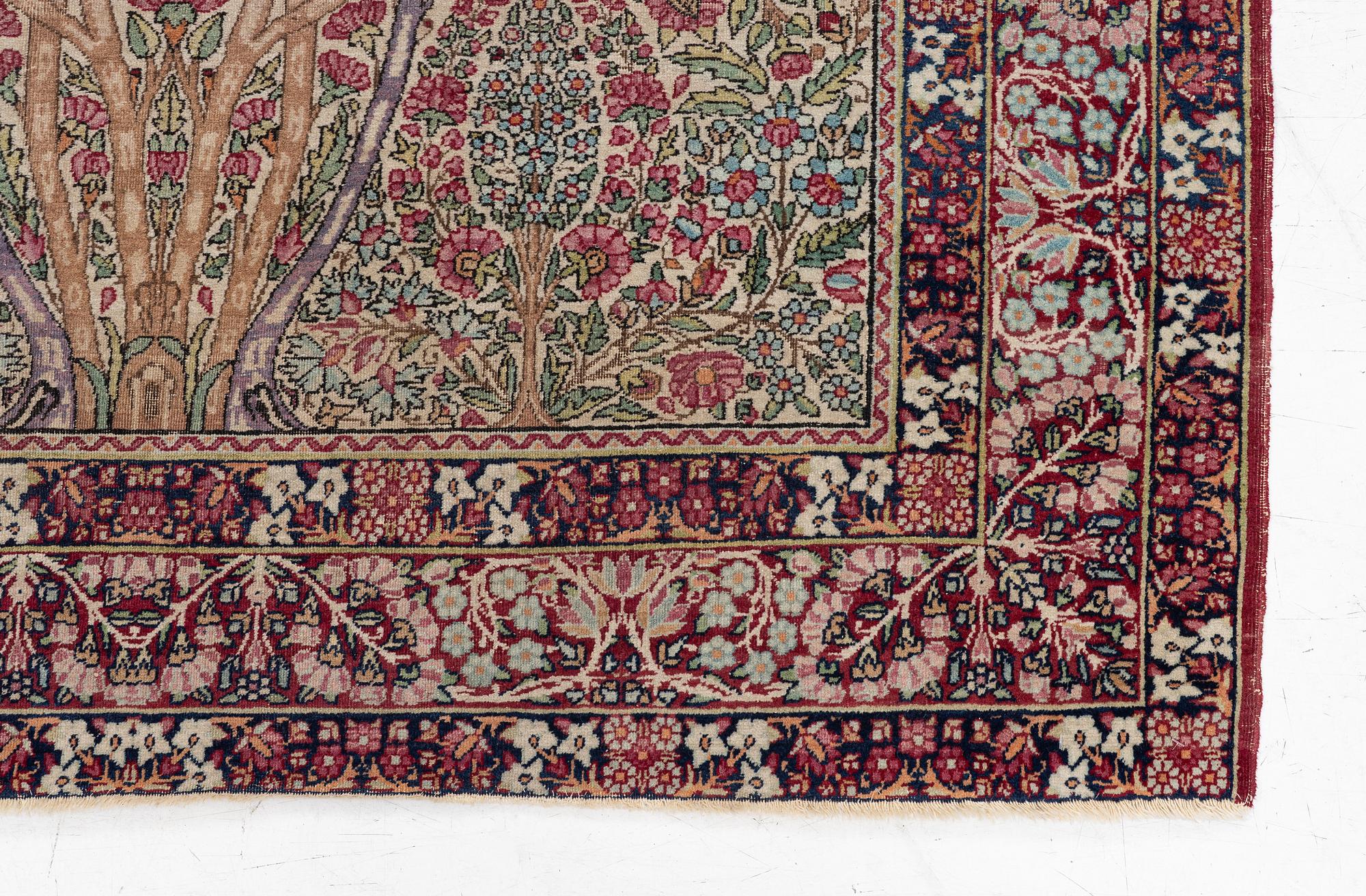 An antique Kirman rug, south Persia, c. 220 x 140 cm.