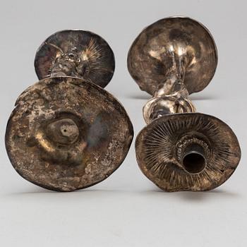 A 20th Century pair of art noveau style candle sticks marked A.W.OX.