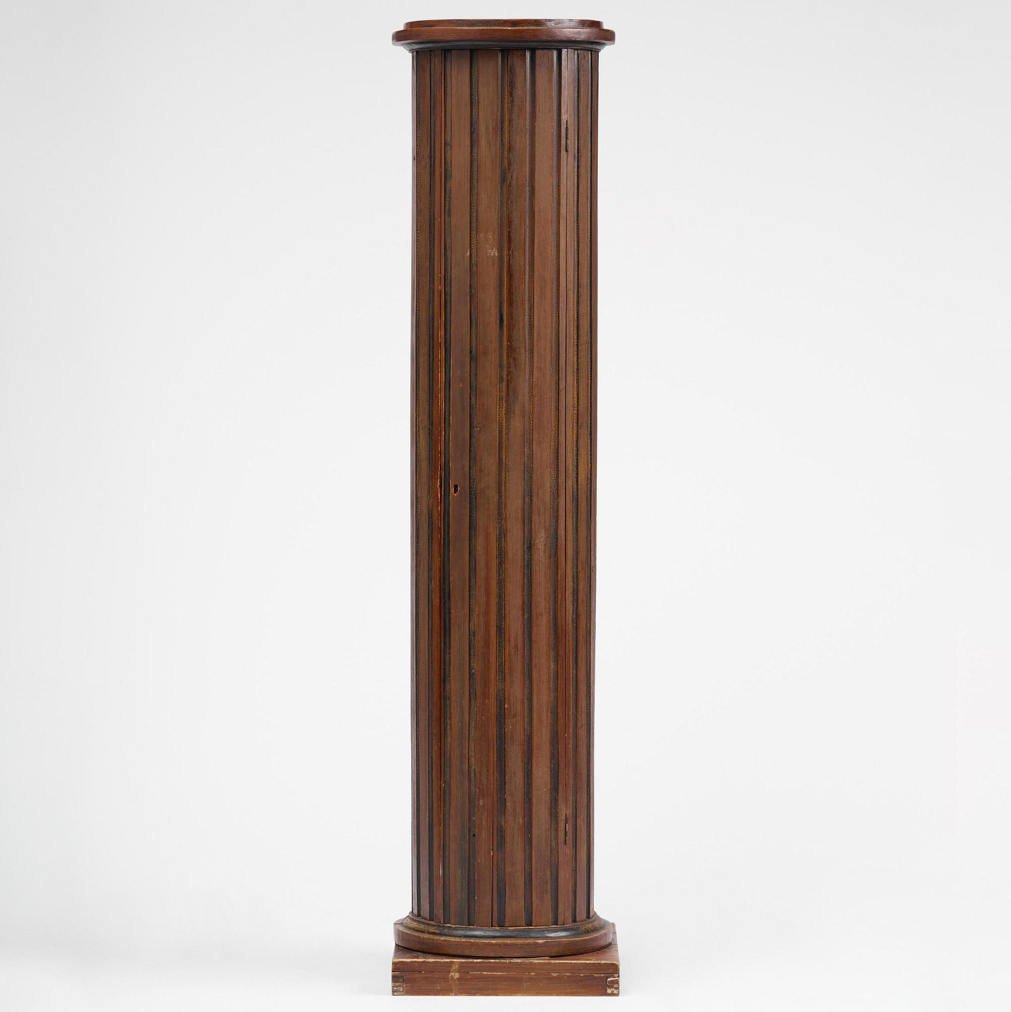 A Swedish Empire column-shaped cabinet, first part 19th century.