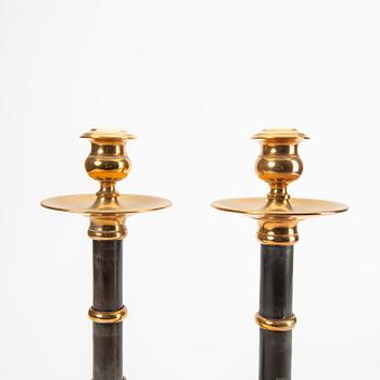 A pair of brass and wood candle sticks early 1900s.