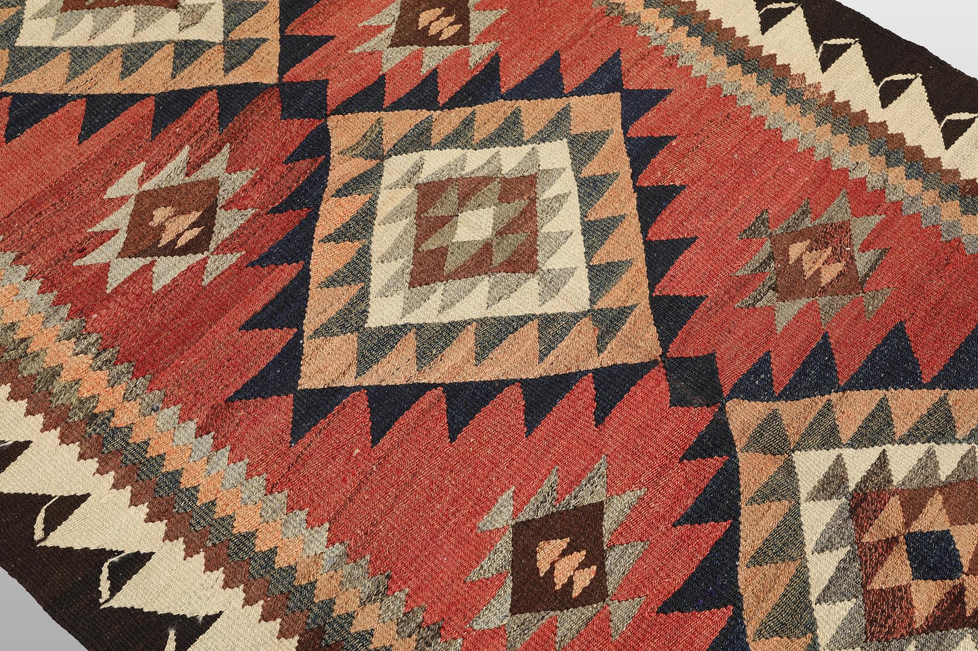 A Nomad Kurdish kilim rug, 270 x 132 cm.