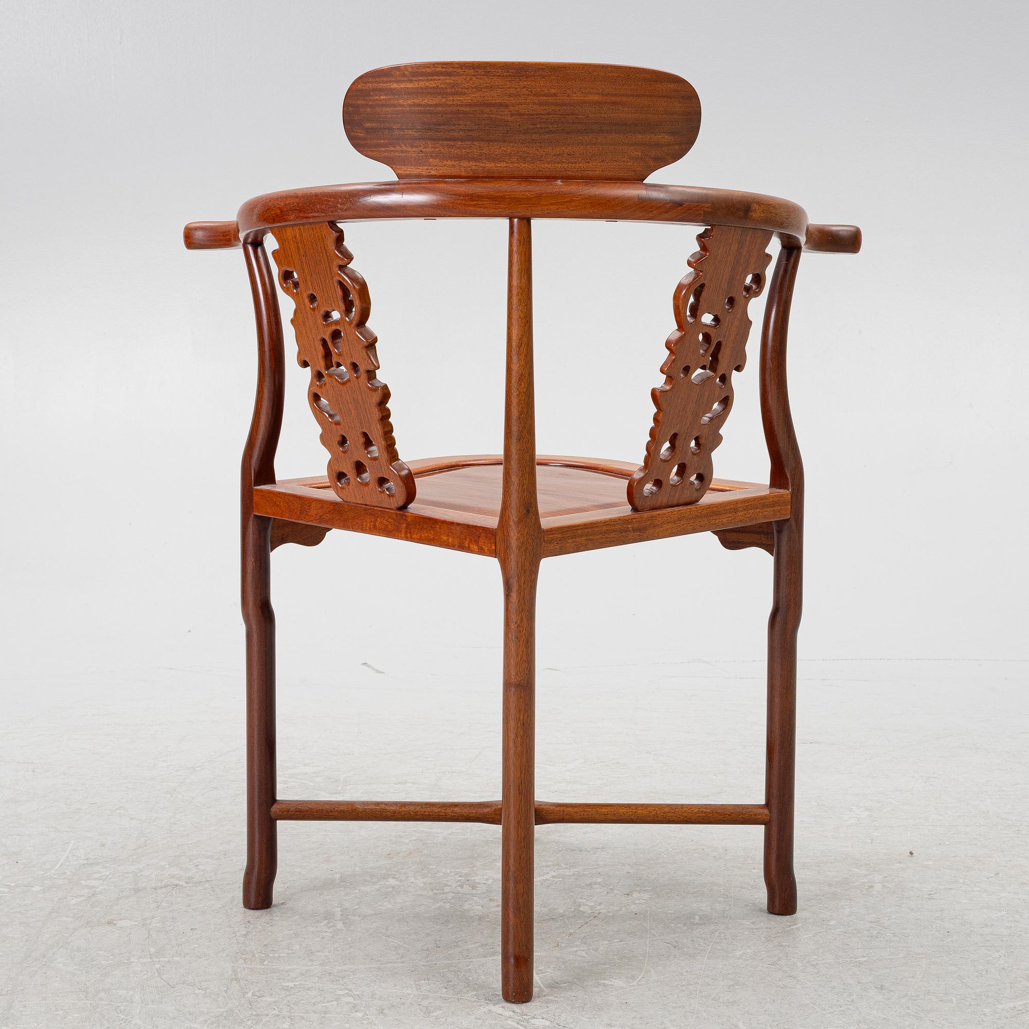 A Chinese hardwood corner armchair, 1900s.