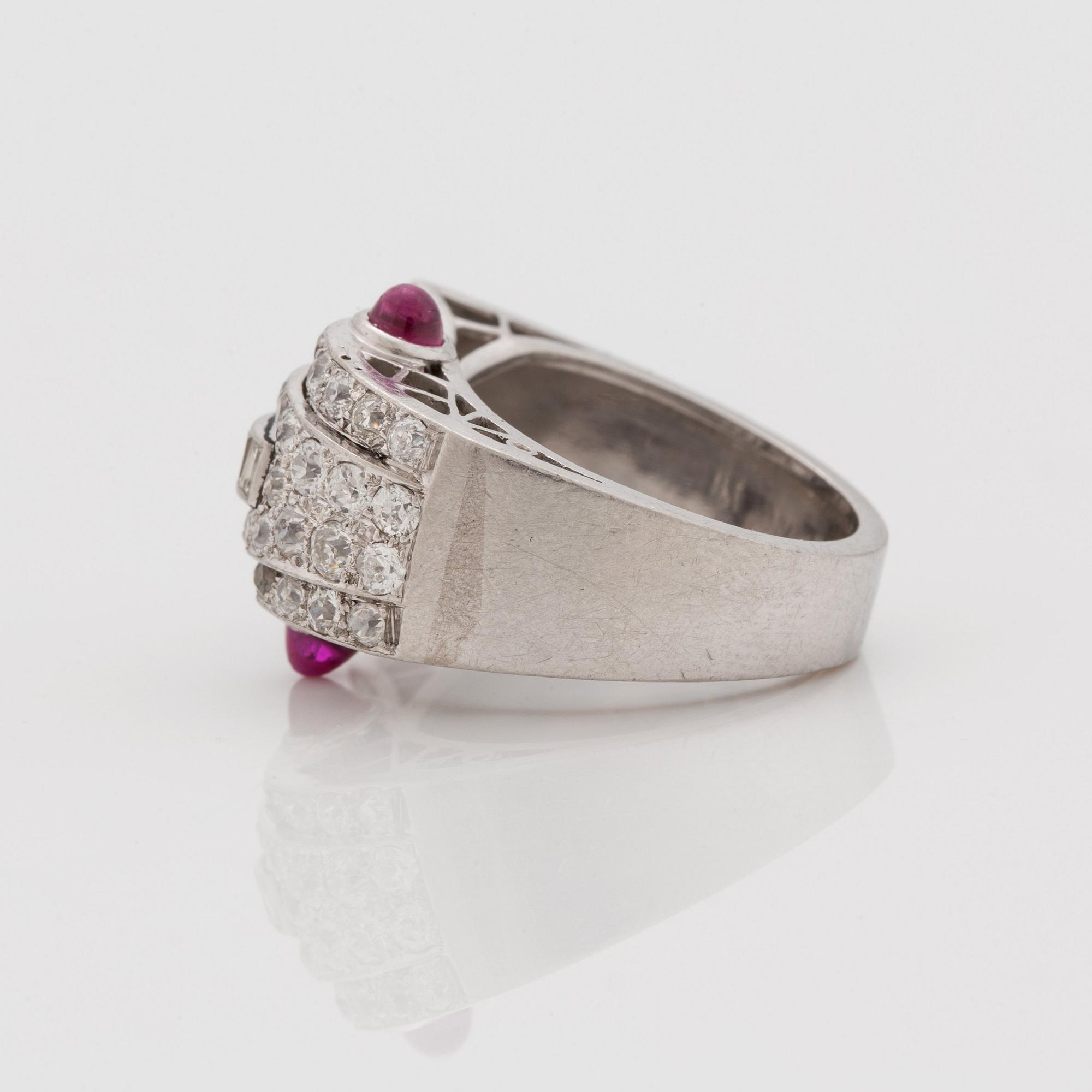 An odeonesque cabochon cut ruby, old- and step- cut diamond ring. Circa 1940's.