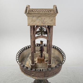 A painted and richly decorated plate garden fountain, late 19th century.