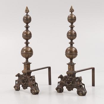 A pair of brass andirons, first half of the 20th century.