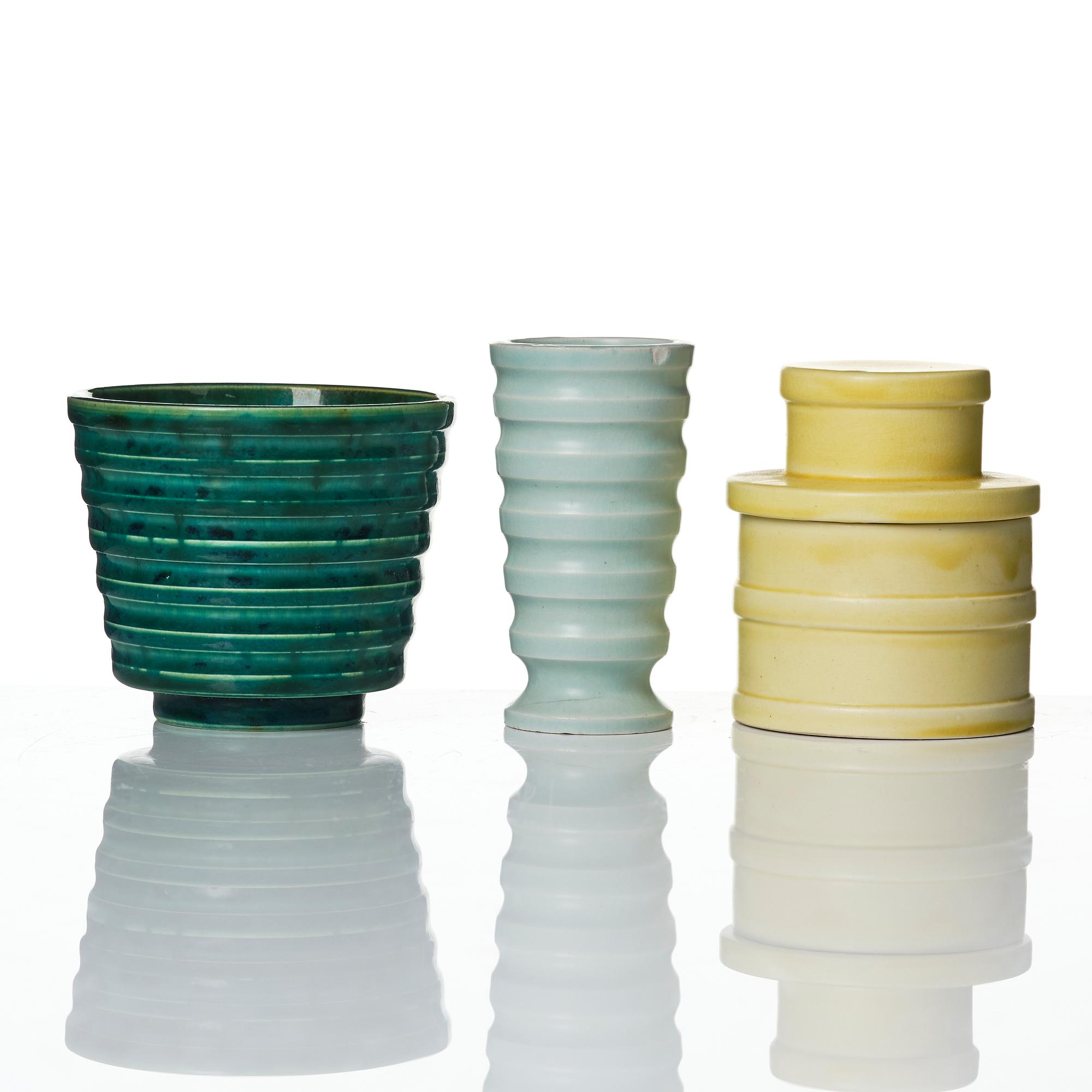 Wilhelm Kåge, A set of three ceramic flower pots, a vase and jar with lid,  Gustavsberg 1930s.