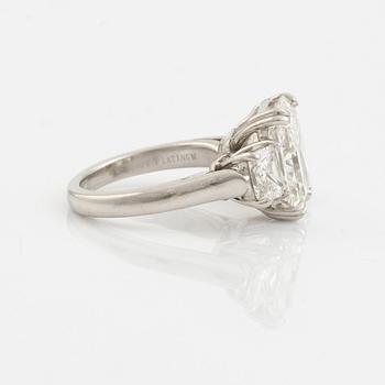 A platinum ring set with a radiant-cut diamond 6.21 ct H vs2, by KWIAT.