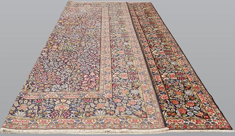 A Kerman Laver carpet, 'Millefleur', approx. 406 x 295 cm.