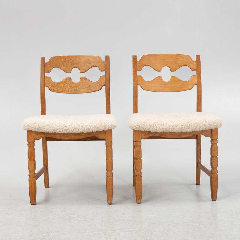 Henning Kjærnulf, a set of six oak 'razorblade' chairs, with new sheepskin upholstery, for EGK, 1960s.