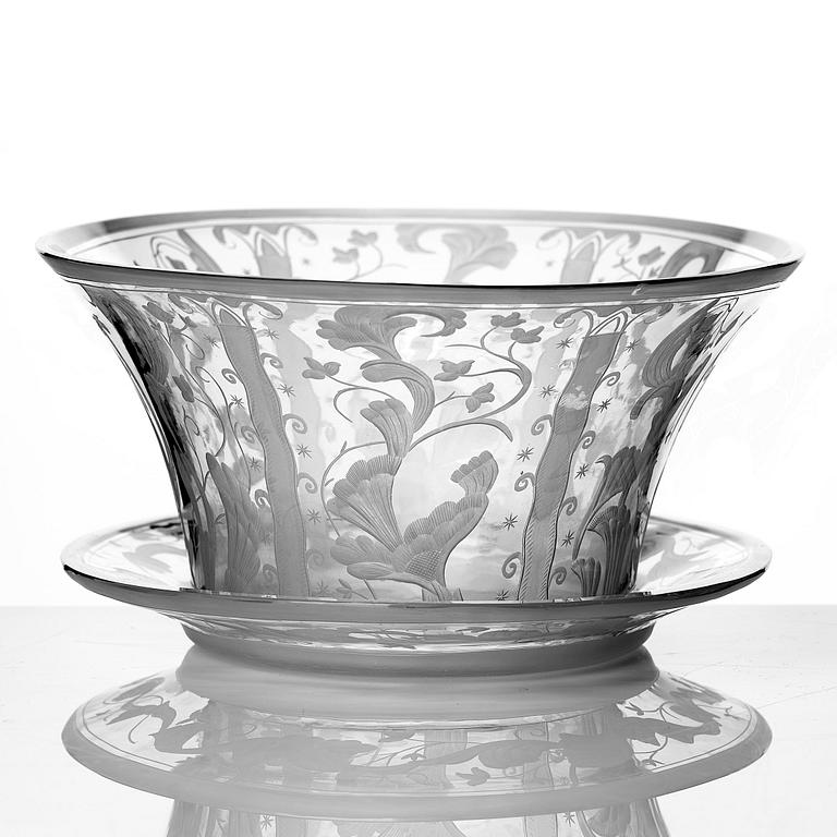 Simon Gate, a Swedish Grace engraved glass bowl with stand, Orrefors 1930, model 147, engraved by Karl Rössler.