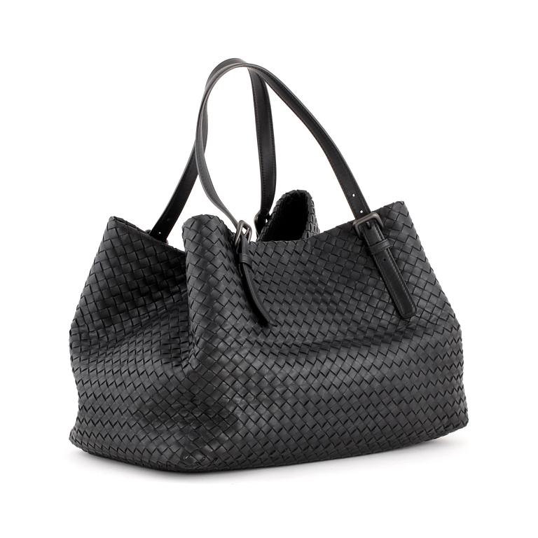 BOTTEGA VENETA, a black woven leather tote bag.