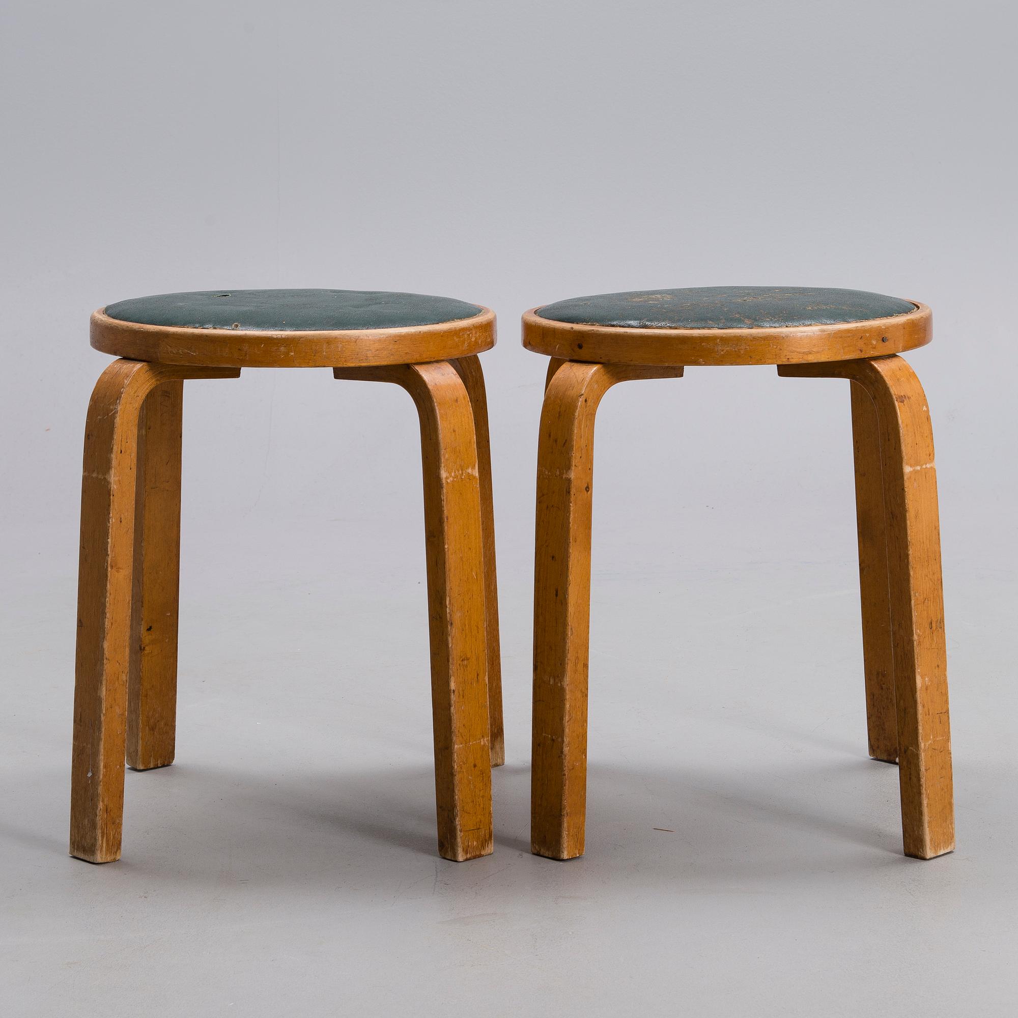 ALVAR AALTO, A PAIR OF STOOLS.