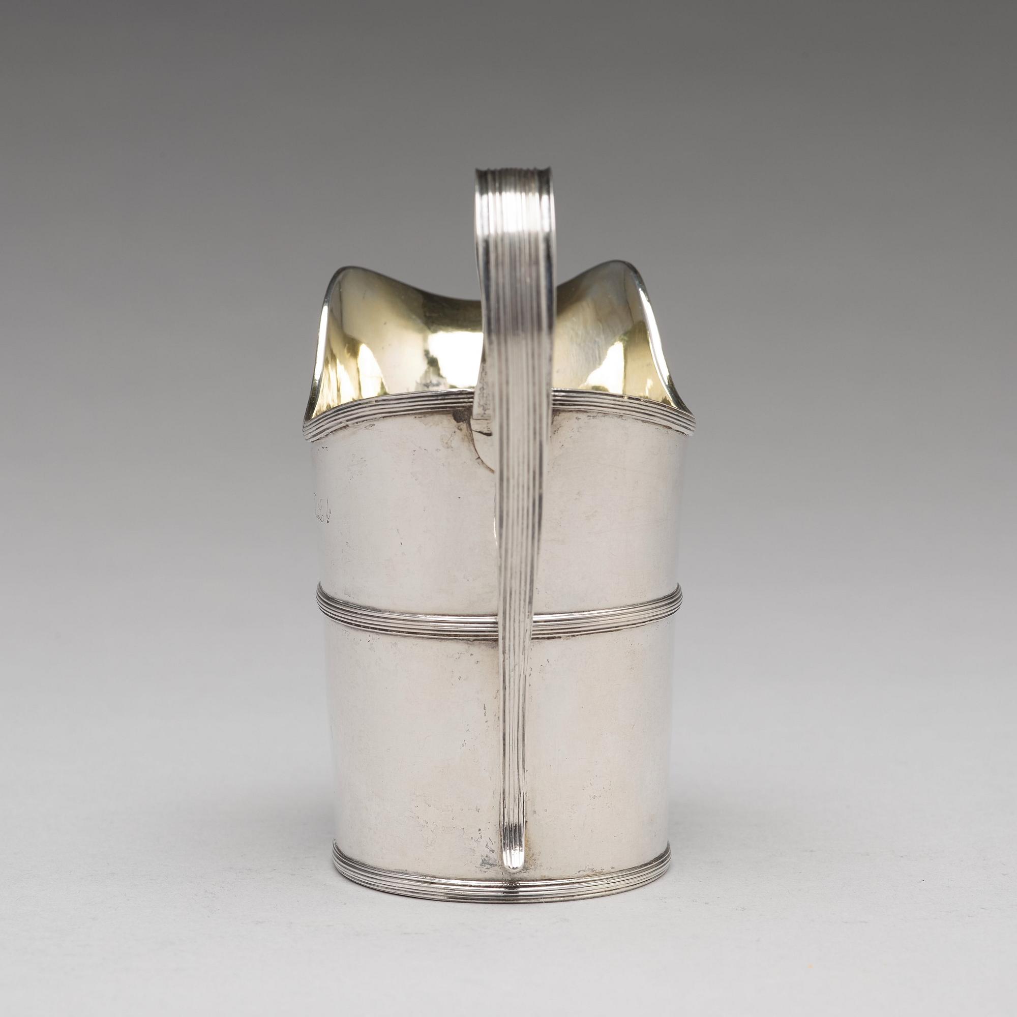 A Swedish early 19th century parcel-gilt silver cream-jug, mark of Nils Limnelius, Stockholm 1810.