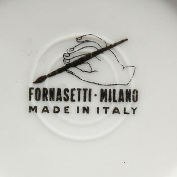 A st of three Piero Fornasetti porcelain plates.