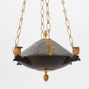 A Swedish Empire ormolu, patinated bronze four-light chandelier, early 19th century.