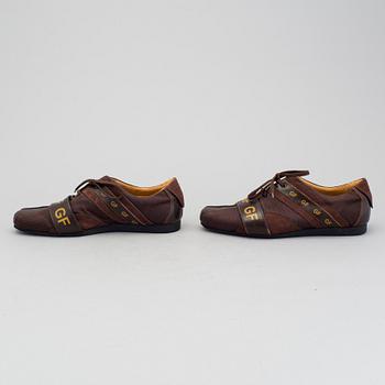 a pair of sneakers by Gianfranco Ferre.