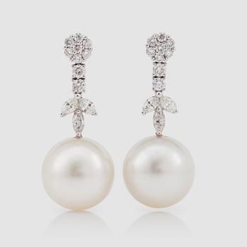 1120. A pair of cultured pearl 14 mm, and diamond 1.47 cts, earrings.