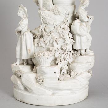 A biscuit porcelain figure group, circa 1900.