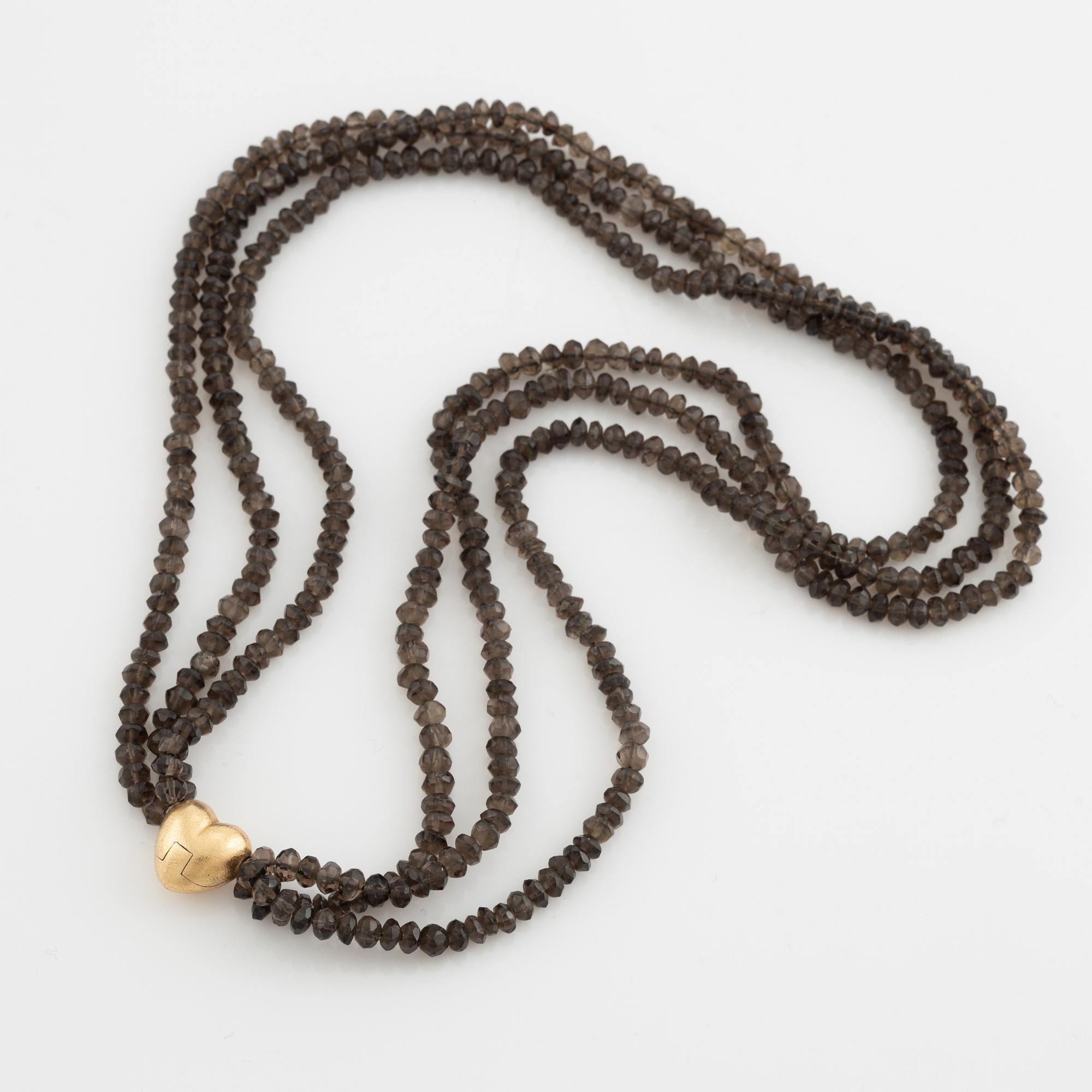 Ole Lynggaard,  smoky quartz necklace, clasp gold heart.