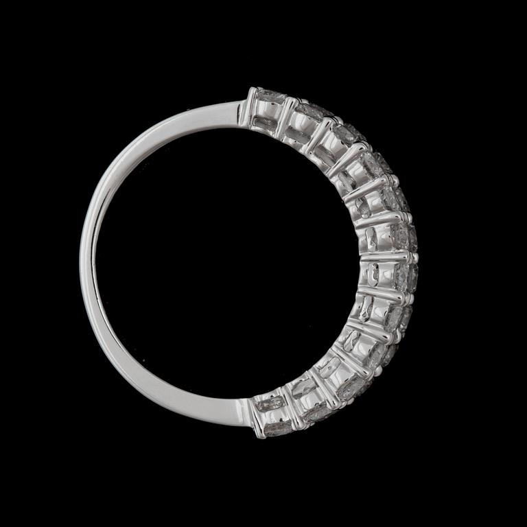 A brilliant- and emerald cut diamond ring.