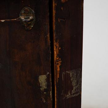 A 19th century corner cabinet.