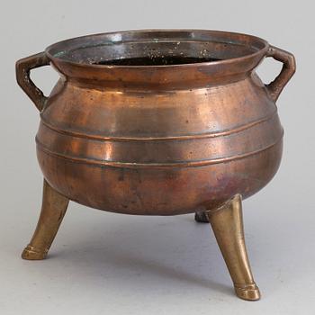 A Swedish 18th/19th century brass pot on three legs.