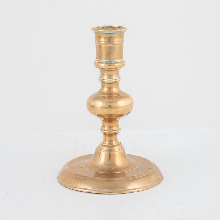 A Baroque brass candlestick, 17th century.
