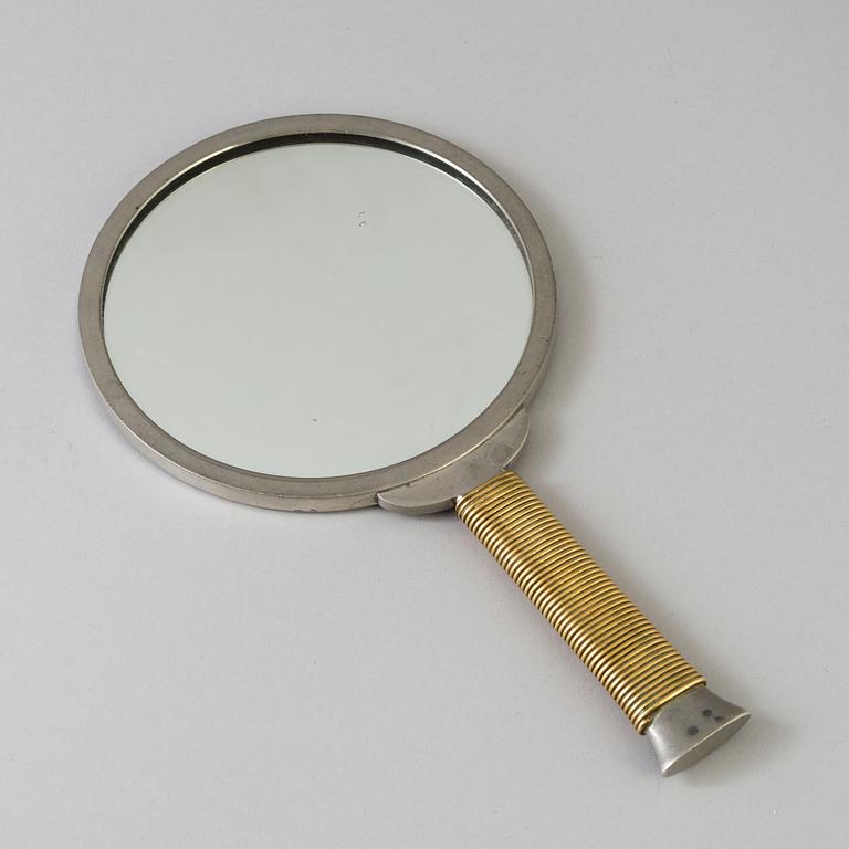 ESTRID ERICSON AND BJÖRN TRÄDGÅRDH, a pewter and brass handmirror from Firma Svenskt Tenn.