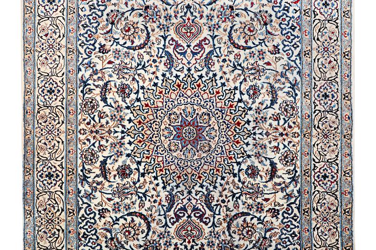 A Nain carpet, part silk, 9 laa, c. 293 x 199 cm.