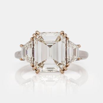 A 4.05ct emerald cut diamond ring. Quality circa I/VS.