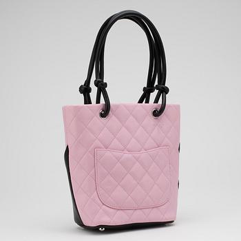 CHANEL, a pink leather "Small Shopping" handbag.