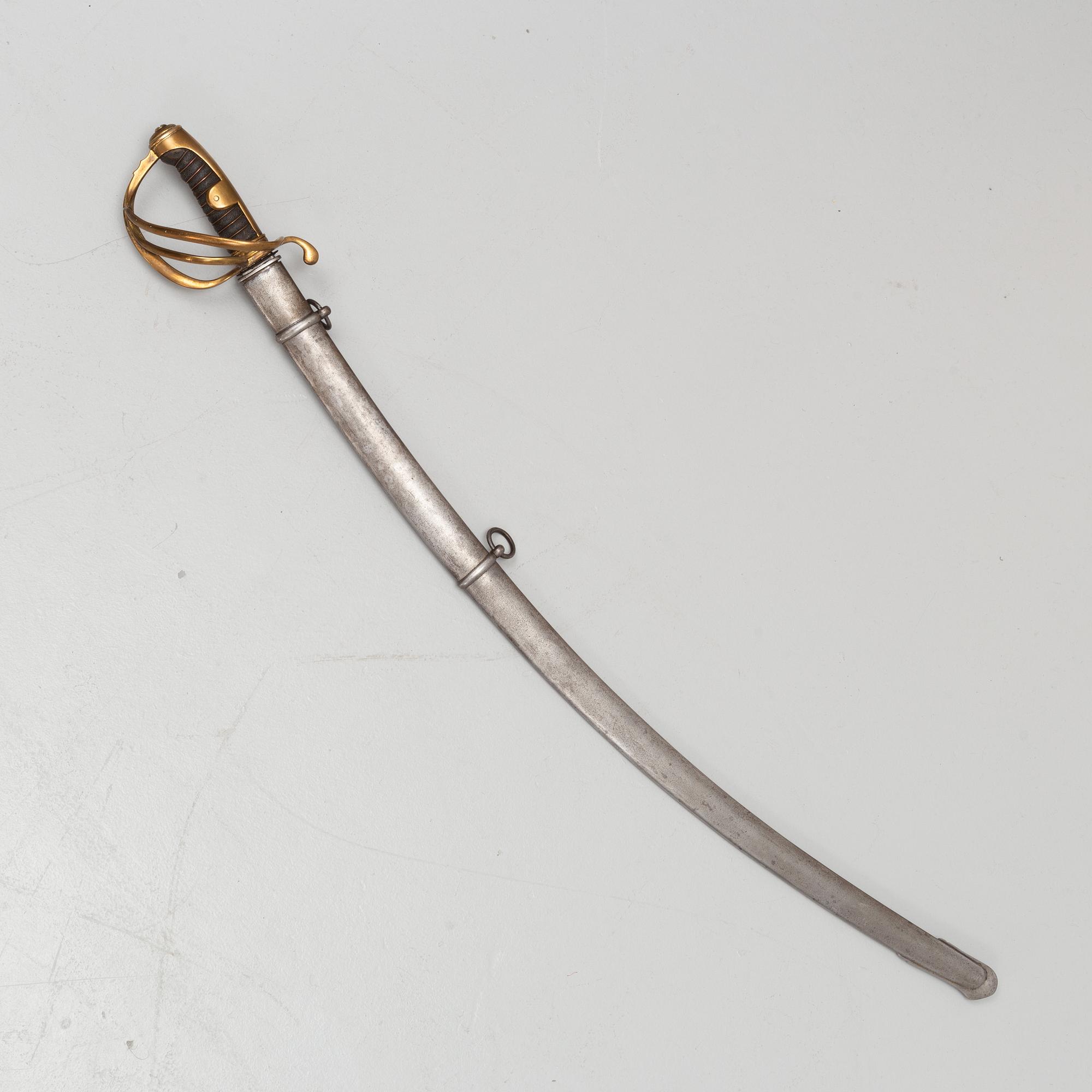 An 19th Century curved officer's sword with etched blade and steel scabbard.
