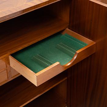 A 1940s mahogany veneered cabinet.