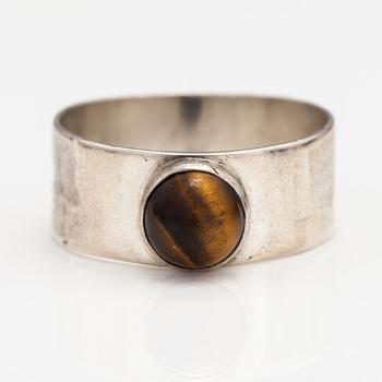 A silver ring and necklace with tiger's eye. Kultasepät Salovaara, Turku 1961.