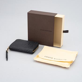 Louis Vuitton, a black, embossed leather wallet, 2015.