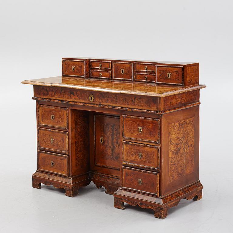 A Swedish late Baroque alder-veneered 'knee-hole' writing desk, first part of the 18th century.