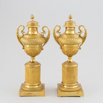 A pair of French Empire candlesticks, early 19th century.