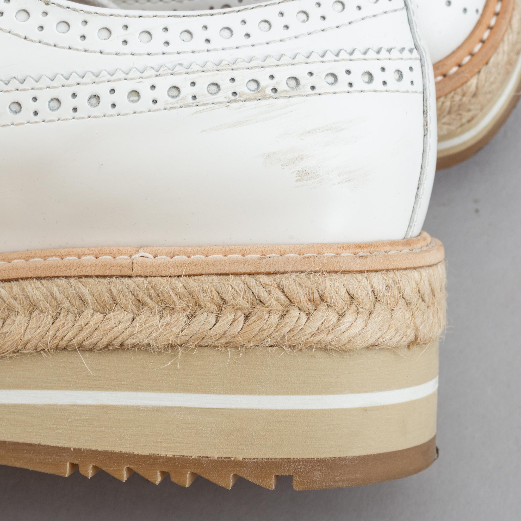 Prada, a pair of white leather brogues, size 36.