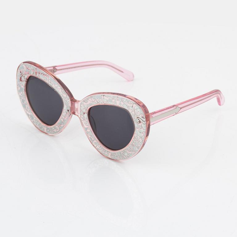 Karen Walker, a pair of pink "Intergalactic" sunglasses.